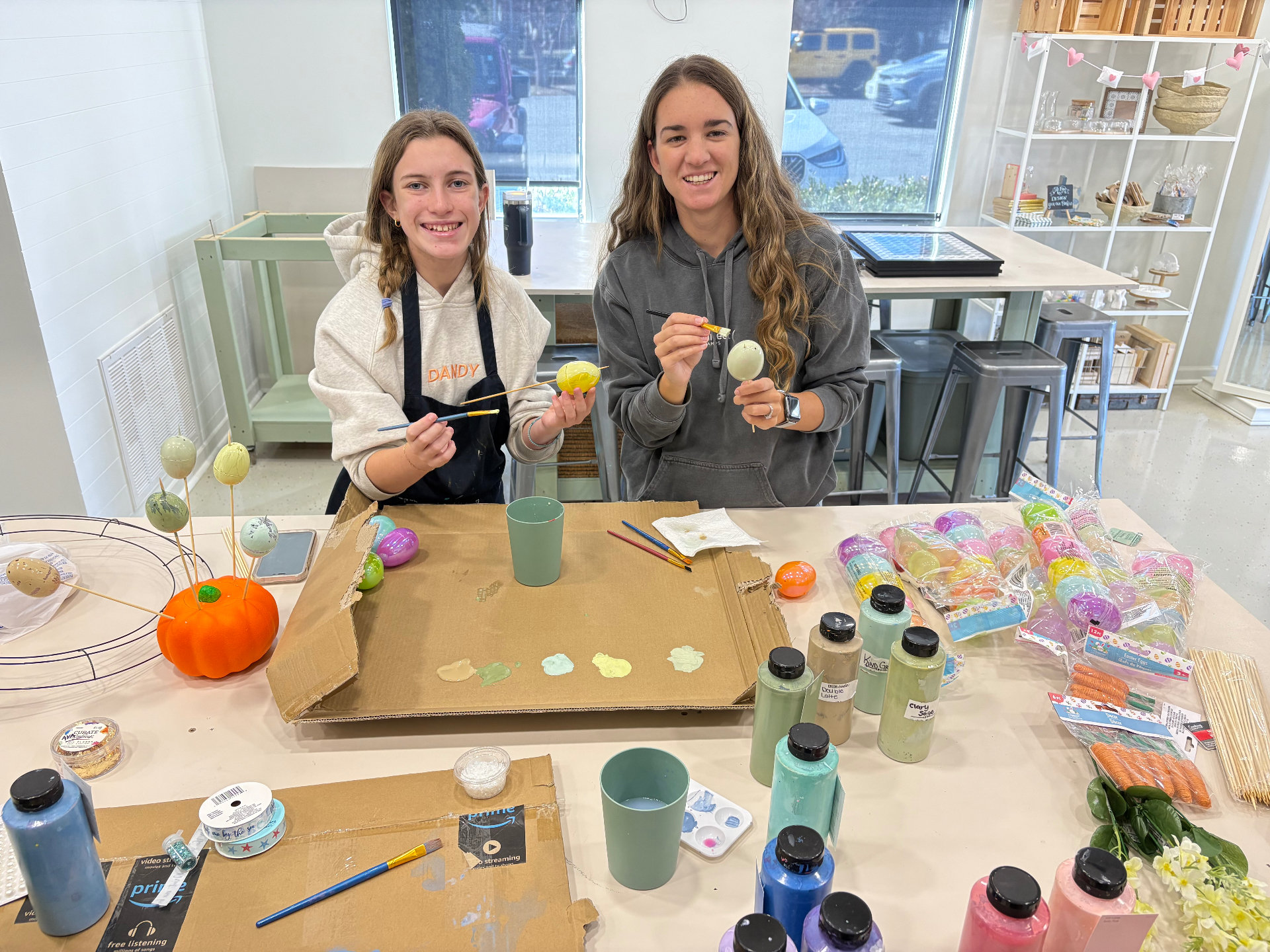 Customers painting Easter eggs at a Down Under D.I.Y. workshop